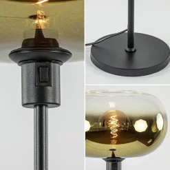 Outlet Straluma Mat zwarte vloerlamp met glazen kap helder/goud